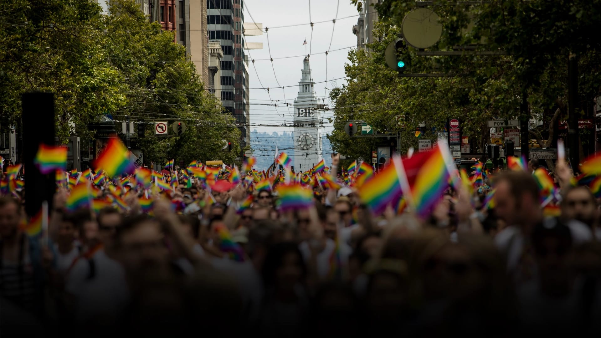 San Francisco's Ferry Builiding is seen behind marchers in the San Francisco Gay Pride Parade, June 28, 2015 in San Francisco, California
