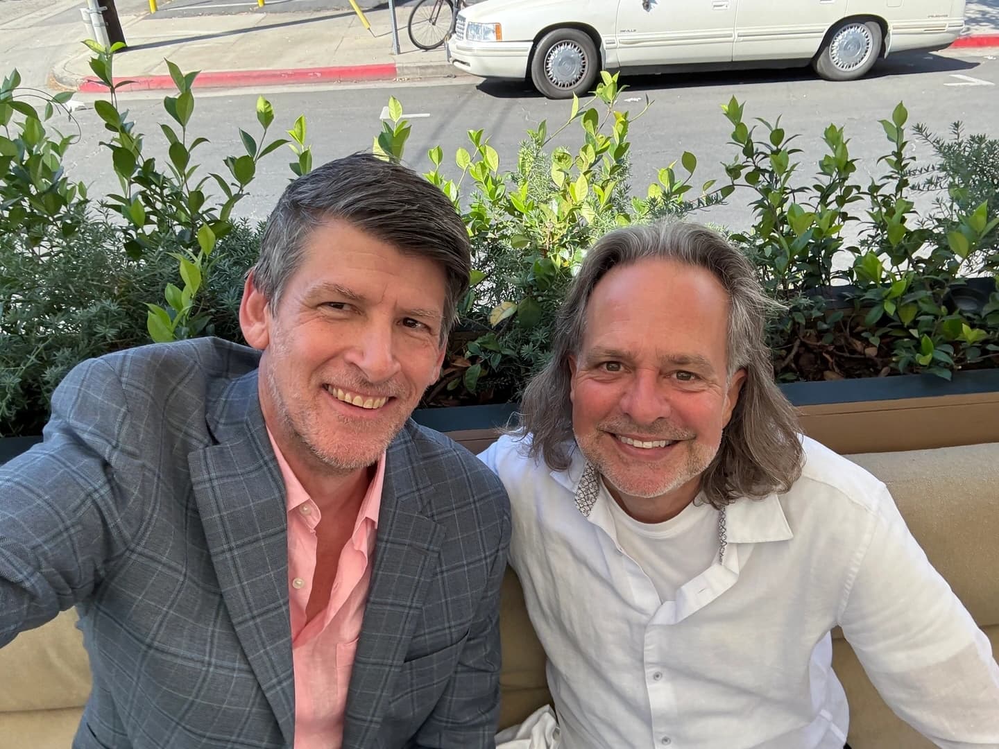 John Rabe and session violinist Charlie Bisharat at a cafe in Brentwood.